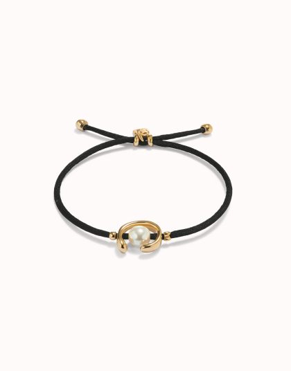 Pulsera de hilo negro con perla shell fornitura bañada en oro 18k.